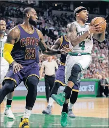  ?? PRESS] [ELISE AMENDOLA/THE ASSOCIATED ?? The Celtics’ Isaiah Thomas, being guarded by the Cavaliers’ LeBron James in Friday’s game, will miss the rest of the playoffs because of a hip injury.