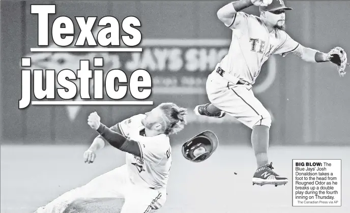  ?? The Canadian Press via AP ?? BIG BLOW: The Blue Jays’ Josh Donaldson takes a foot to the head from Rougned Odor as he breaks up a double play during the fourth inning on Thursday.