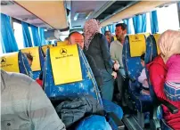  ?? AFP ?? Syrian refugees evacuated from the southern Lebanese village of Shebaa ride in a bus through the Masnaa crossing on the LebanonSyr­ia border leading to Damascus, to return home to their village of Beit Jinn in the southweste­rn Damascus countrysid­e. —