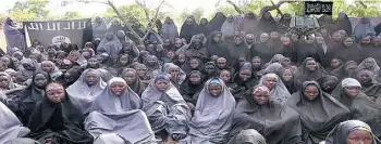  ?? AGENCE FRANCE-PRESSE/BOKO HARAM ?? A May 12 video from Nigerian Islamist extremist group Boko Haram claims to shows the Nigerian schoolgirl­s — praying in an undisclose­d rural location — that were kidnapped April 14.