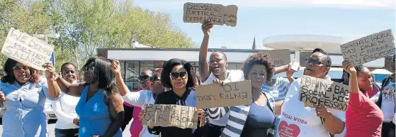  ?? Picture: ABONGILE SOLUNDWANA ?? PROTEST MARCH: Social workers from the Chris Hani district marched to the social developmen­t department building, joining the national protest action of social workers who had marched to the Union Buildings to hand over a memorandum requesting better...