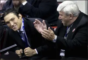  ?? GRANT HALVERSON — THE ASSOCIATED PRESS FILE ?? Alex Ovechkin, left, smiles after being selected as the first overall pick by the Washington Capitals during the NHL Draft on June 26, 2004, at the RBC Center in Raleigh, N.C. At right is Ovechkin’s father Mikhail.