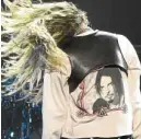  ??  ?? Cyrus wears a jacket bearing a picture of the late Chris Cornell