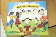 ?? Ned Gerard / Hearst Connecticu­t Media ?? “What Does it Mean to Be Global?” by Rana DiOrio, a book being read this year by the students of Sunnyside Elementary School in Shelton.