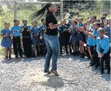  ??  ?? INFUSING JOY: Nokuphiwa Tshabane with the kids in her community