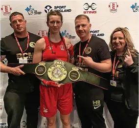  ?? ?? COVETED BELT: Dione Burman celebrates her achievemen­t with Clare Lynch, right, Chris Walsh and Anthony Sutton of Braunstone Golden Gloves