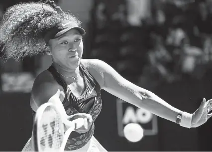  ?? Andy Brownbill, The Associated Press ?? Naomi Osaka hits a forehand return to Serena Williams during their match at the Australian Open on Thursday. Osaka beat Williams and will face No. 22 seed Jennifer Brady in the women’s singles championsh­ip.