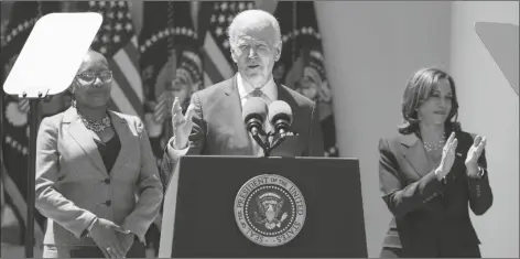  ?? MANUEL BALCE CENETA/AP ?? VICE PRESIDENT KAMALA HARRIS applauds as President Joe Biden speaks at an event on lowering the cost of high-speed internet in the Rose Garden of the White House on Monday in Washington.