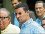  ?? DIGITAL FIRST MEDIA FILE PHOTO ?? Montgomery County Commission­er Joe Gale, center, and members of the Montgomery County Planning Commission and Pottstown officials listen to speakers during a tour of the borough.