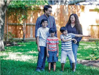  ?? Mark Mulligan / Staff photograph­er ?? Dr. Abid Iqbal and his wife, Jannatun, have been spending a lot of time in the backyard of their Katy home with their three children, Eshan, 11, Aiyan, 6, and Elaan, 7.