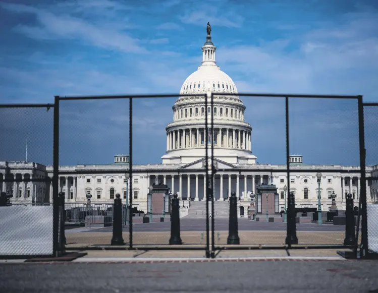  ?? Image caption ?? Fencing, erected after the Jan. 6 riot, is seen surroundin­g the Capitol building on Capitol Hill, in Washington, D.C., U.S., July 9, 2021.