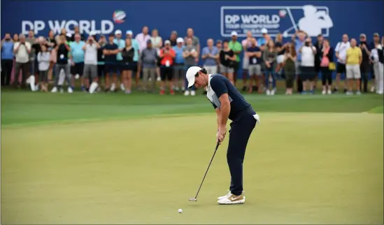  ??  ?? Rory McIlroy finishes his round on a high with an eagle for an eightunder-par 64, while left, Robert MacIntyre shot a 71