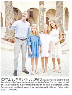  ??  ?? Spanish King Felipe VI (left) and Queen Letizia (right) pose with their daughters Spanish Crown Princess Leonor (second left) and Princess Sofia at the Almudaina Palace on the island of Majorca on Sunday. The royal family traditiona­lly spends its...
