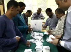  ??  ?? Electoral workers sort ballots to count votes after polls closed during the presidenti­al election in Cairo, Egypt. — Reuters photo