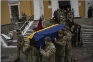  ?? DANIEL COLE — THE ASSOCIATED PRESS ?? Soldiers carry the coffin of Eduard Strauss, a Ukrainian serviceman who died in combat on Jan. 17 in Bakhmut, during a farewell ceremony in Kyiv, Ukraine, Monday, Feb. 6, 2023.