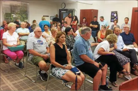  ?? EVAN BRANDT — DIGITAL FIRST MEDIA ?? It was standing-room-only at Aug. 16’s public hearing on the Phoenixvil­le School Board’s plan to buy 29.5 acres off Hare’s Hill Road for $4 million and the possible home for a new elementary school.