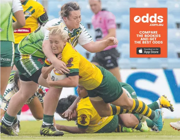  ?? Picture: AAP ?? The NT’s Meg Ward scores a try for Australia in their World Cup match against the Cook Islands at Southern Cross Group Stadium on Thursday