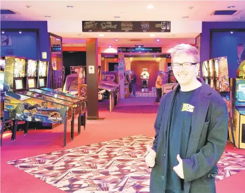  ?? RYAN KNELLER/THE MORNING CALL PHOTOS ?? Back to the Arcade co-owner Wyatt Paden poses inside the business’ new space at the South Mall in Salisbury Township. Back to the Arcade features more than 70 retro and modern arcade games.