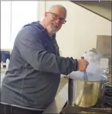  ??  ?? Steve Sweeney was busy in the Peachland Community Centre kitchen mixing up a pot of hot chocolate at the Peachland Community Centre.