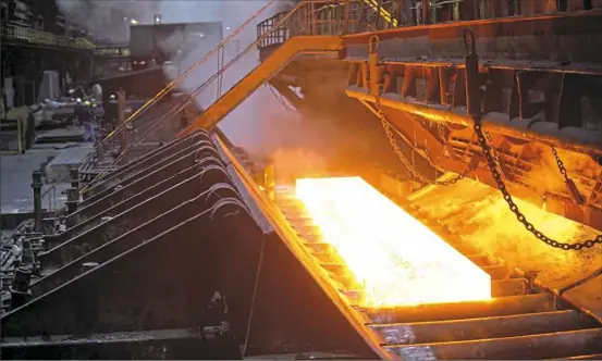  ?? NLMK USA ?? An image from the manufactur­ing process at NLMK's Farrell Mill, which uses imported steel slabs to convert to sheet steel. The company has about 800 workers at plants in Sharon and Farrell.