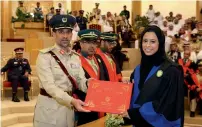  ?? Wam ?? Sheikh Hamdan attended the graduation ceremony of the 25th batch of cadet officers of the Dubai Police Academy; (right) Major-General Abdullah Khalifa Al Marri honours a new graduate. —