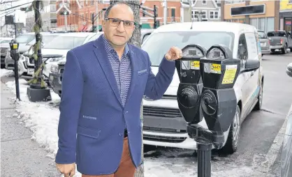  ?? DAVE STEWART • THE GUARDIAN ?? Joseph Dow, owner of Dow’s Men’s Wear in Charlottet­own, said city council made a wise decision to freeze parking rates.