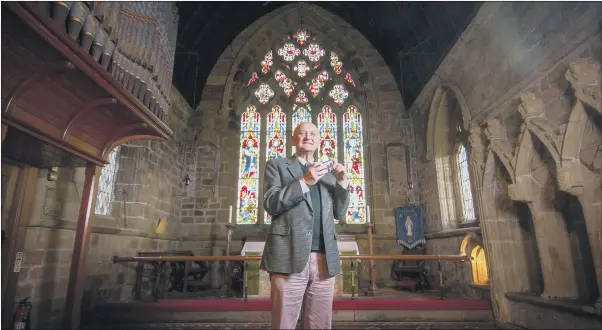  ?? PICTURE: TONY JOHNSON ?? BREADTH OF STORYTELLI­NG: The Rev William Thackray, in St Helen’s Church, Ainderby Steeple, Northaller­ton. He has written a book about Yorkshire’s history in stained glass.