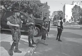  ?? NASSER NASSER/AP ?? Newly deployed Palestinia­n security forces are stationed at a main junction in the occupied West Bank city of Jenin.