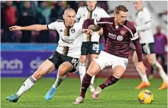  ?? ?? FINAL ACT Brown struggles to catch Hearts’ Stephen Kingsley and cops a booking (above) as parting bow