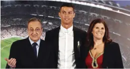  ?? — AFP ?? MADRID: Real Madrid’s Portuguese forward Cristiano Ronaldo (C), club president Florentino Perez and Ronaldo’s mother Maria Dolores dos Santos Aveiro pose during the official presentati­on of Ronaldo’s contract renewal, in the presidenti­al box at the...