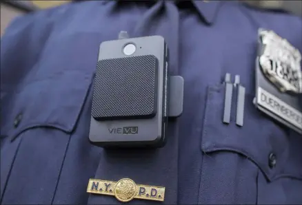  ?? MARY ALTAFFER - ASSOCIATED PRESS ?? In this April 27, 2017file photo, a police officer wears a newly-issued body camera in New York.