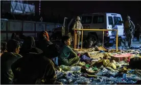  ?? Photograph: Marcus Yam/Los Angeles Times/Rex/Shuttersto­ck ?? Afghan refugees outside Kabul airport near the site of the blast on Thursday.