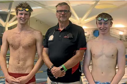  ??  ?? Swimmers Riley Taylor, 19, left, and Matthew Moore, 17, have qualified for the New Zealand Open Championsh­ips in Auckland at the end of the month. They are with CBay head coach Oscar van Stekelenbo­rg.