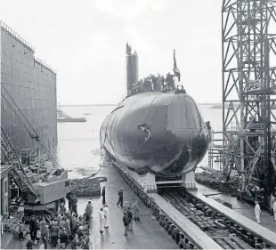  ??  ?? Britain’s first nuclear-powered submarine HMS Dreadnough­t is launched in Barrow-in-furness in 1960.