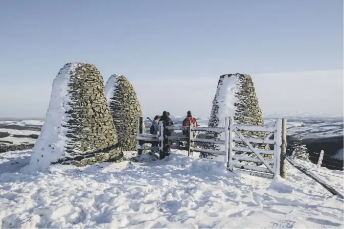  ??  ?? Walter Baxter of Galashiels snapped the 3m tall cairns on the summit of The Three Brethren, marking the meeting of the boundaries of Selkirk Burgh, Yair Estate and Buccleuch Estate
