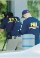  ?? WKEF/WRGT ?? FBI evidence team members work Thursday at the FBI office in Kenwood, Ohio, after the incident.