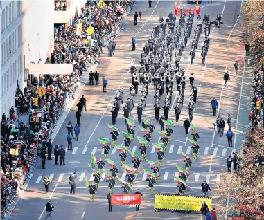  ?? GROUPPHOTO­S.COM KEVIN MCCORMICK/ ?? Lincoln-Way High School’s marching band performs Thursday in the Macy’s Thanksgivi­ng Day Parade in New York City.