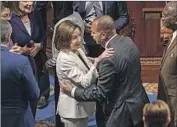 ?? Kent Nishimura Los Angeles Times ?? NANCY PELOSI greets Rep. Hakeem Jeffries, her possible successor as leader of House Democrats.