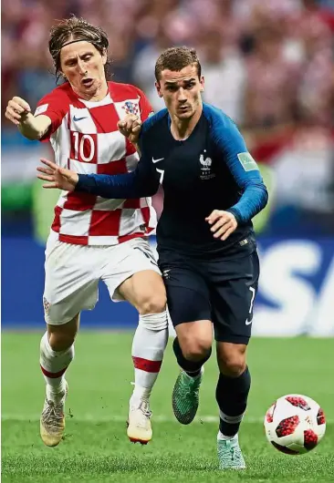  ?? — Reuters ?? That’s mine: Croatia’s Luka Modric in action against France’s Antoine Griezmann.