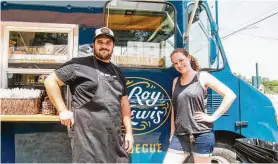  ??  ?? Evan LeRoy, left, and Sawyer Lewis operate their LeRoy and Lewis Barbecue food truck in Austin.