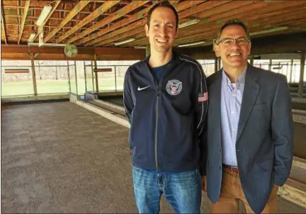  ?? MARK PODOLSKI — THE NEWS-HERALD ?? Nationally ranked bocce player Brian Polantz, left, and director and producer John Vourlis at the Wickliffe Italian-American Club’s bocce courts. Vourlis’ documentar­y, “Breaking Balls,” will be shown at the Cleveland Internatio­nal Film Festival.