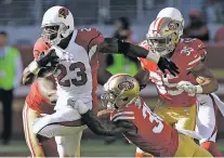  ?? ASSOCIATED PRESS FILE PHOTO ?? Arizona Cardinals running back Adrian Peterson, left, ran for 159 yards against the 49ers on Sunday. With quarterbac­k Carson Palmer out with a broken arm, Arizona is leaning on Peterson even more.