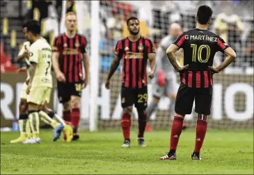  ?? PHOTOS BY FERNANDO LLANO / ASSOCIATED PRESS ?? Atlanta United’s Gonzalo Martinez stands on the pitch Wednesday in a CONCACAF Champions League game in Mexico City. Atlanta United’s second-leg game vs. Club America set for March 18 is postponed.