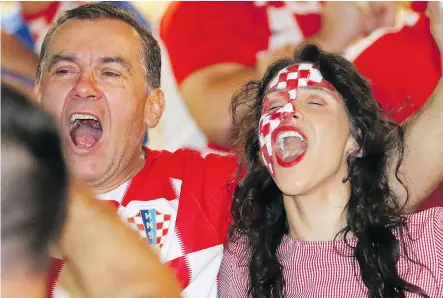  ?? GAVIN YOUNG ?? Croatian fans celebrate at the Croatian-Canadian Cultural Centre after Croatia defeated England in World Cup Soccer semifinal action 2-1 on Wednesday. The Croatians will face the French in the final game.