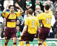  ?? ?? Glorious day in Glasgow: joy for Hammell (centre) in 2008