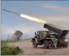  ?? The Associated Press ?? A Donetsk People’s Republic militia’s multiple rocket launcher fires from its position not far from Panteleimo­nivka, in eastern Ukraine.