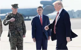  ??  ?? President Donald Trump passes Joint Chiefs Chairman General Joseph Dunford (left) and National Security Adviser Michael Flynn as he arrives via Air Force One at MacDill Air Force Base in Tampa, Florida, on February 6. Trump stopped for a visit to the...