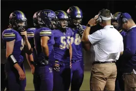  ?? BEA AHBECK/NEWS-SENTINEL ?? Above: Tokay players listen to head coach Michael Holst during their conference game against Tracy at the Grape Bowl on Sept.28. Below: Lodi's Colton Stout gets a touchdown as West's Elijah Mcknight reacts on Oct. 12.