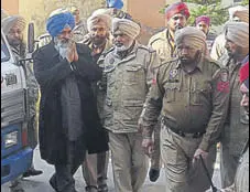 ?? HT PHOTO ?? Former SAD minister Sucha Singh Langah greets supporters after being brought to a court in Gurdaspur on Wednesday.