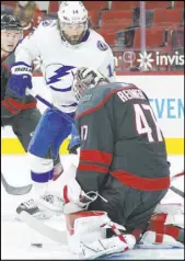  ?? Gerry Broome The Associated Press ?? Hurricanes goaltender James Reimer stops a first-period shot by Lightning left wing Pat Maroon in Carolina’s 4-3 victory Saturday night at PNC Arena.